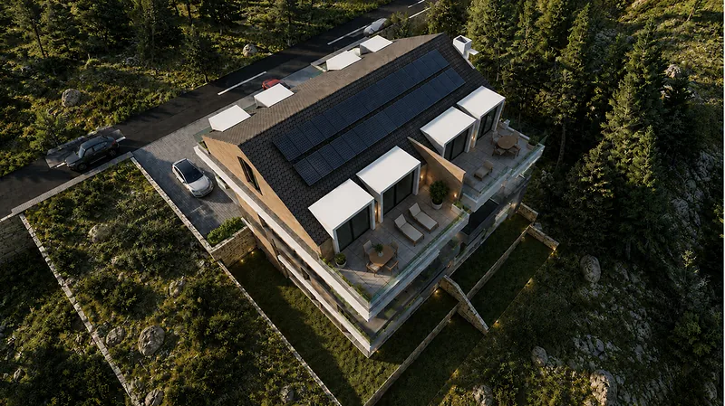 Aerial view of the building with solar panels on the roof