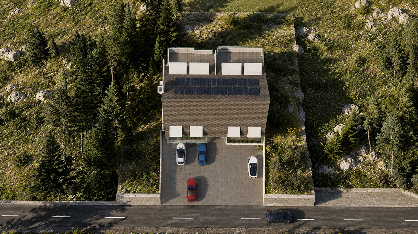 Top view of the site: the building, its parking court and the road, surrounded by pine forest
